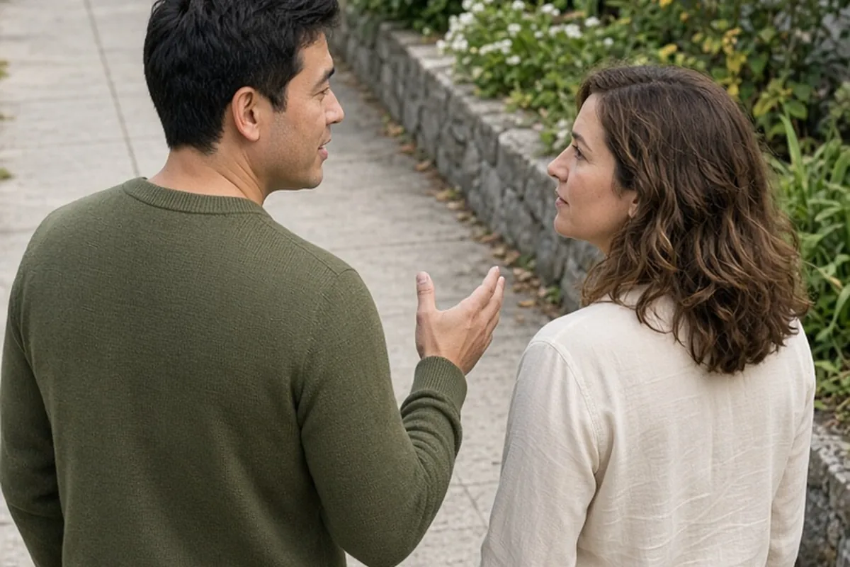 Julian and Sarah walking together on a sidewalk during a conversation about recharge habits, with Julian asking Sarah a question